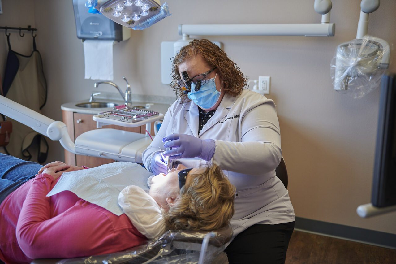 Dentist and patient in chair - Ideal image